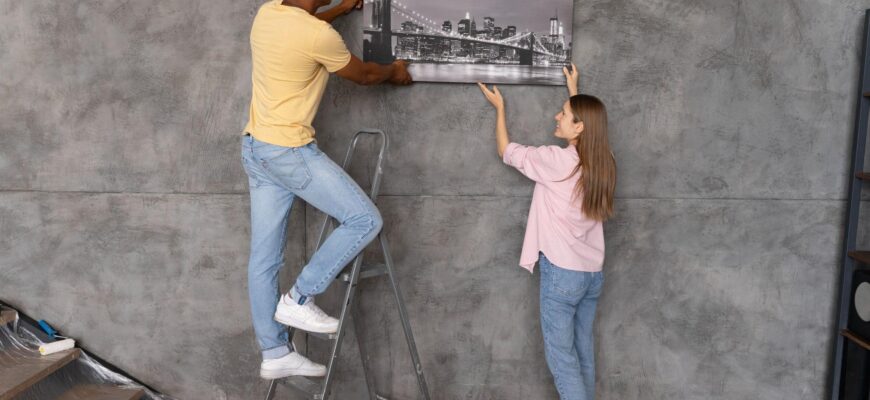 Як легко повісити картину на бетонну стіну без свердління: поради та трюки