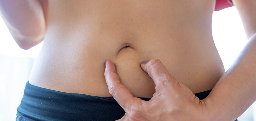 Причини та лікування болю над пупком: поради для покращення самопочуття